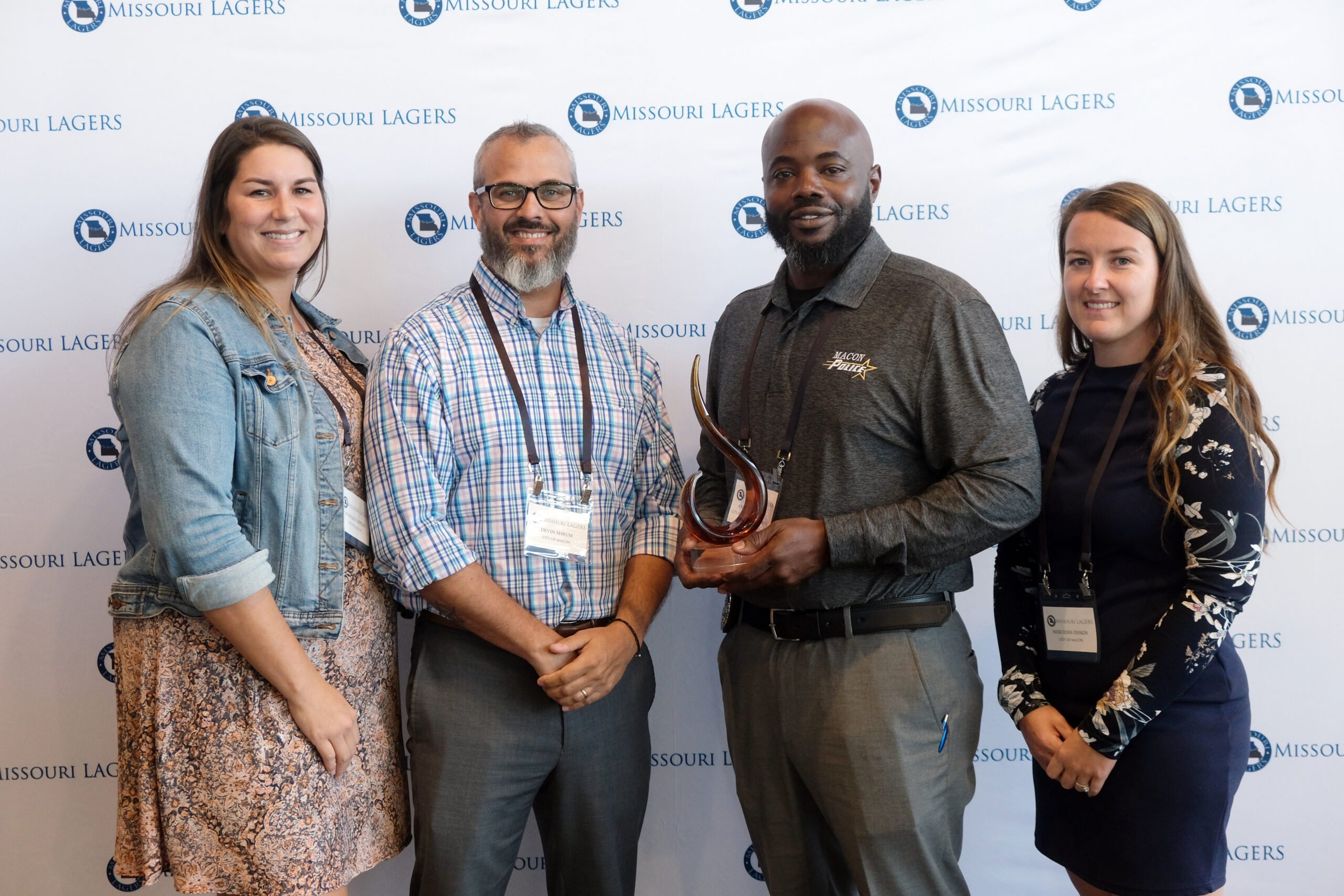 Andre Williams posing with Local Government Hero trophy and his nominators.