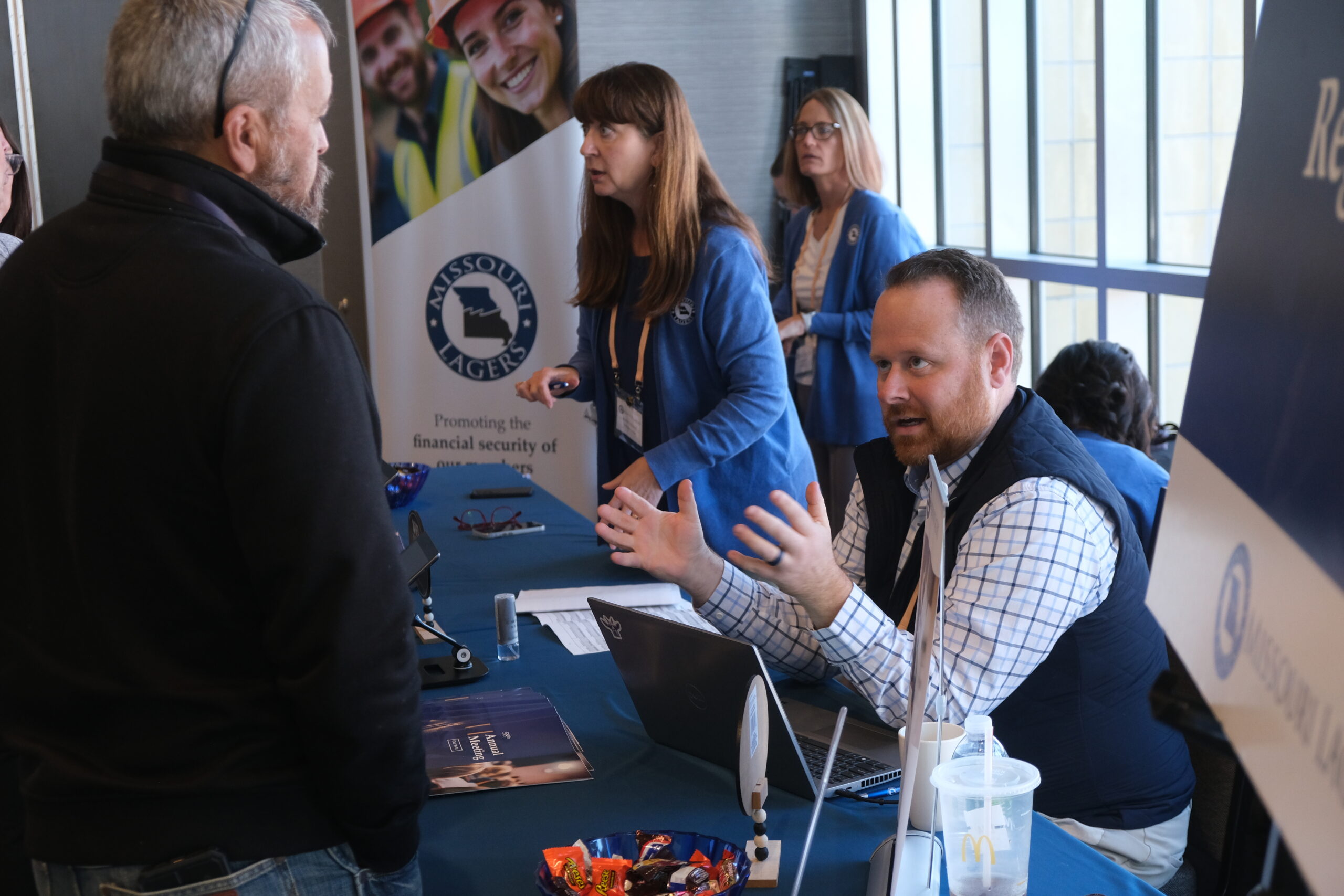 Members at registration desk at Annual Meeting.