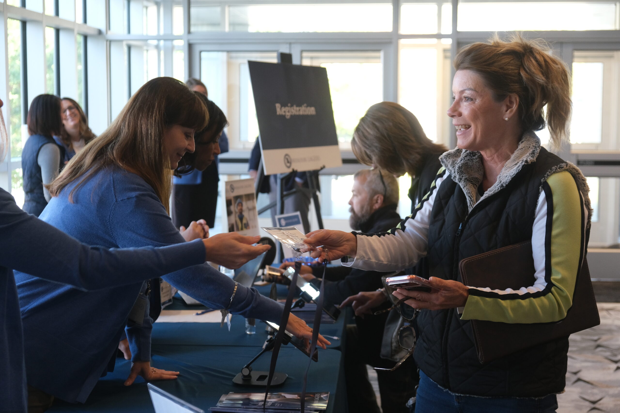 Members at registration desk at Annual Meeting.