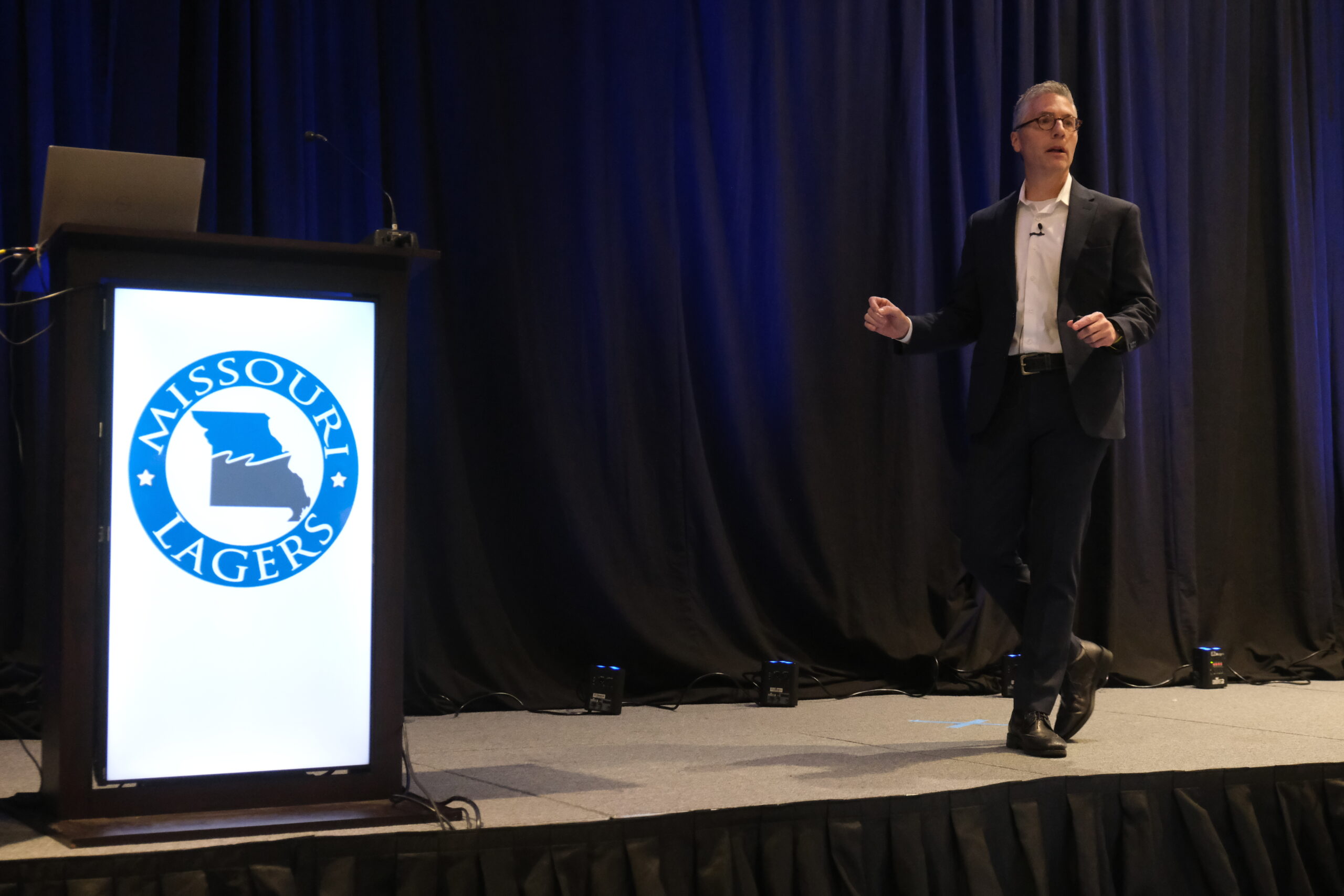 LAGERS CIO Scott Day presenting on stage at Annual Meeting.