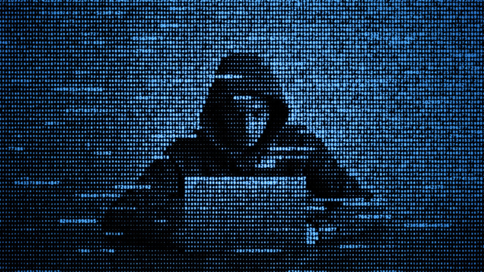 Blue illustration picturing a hacker on a laptop.