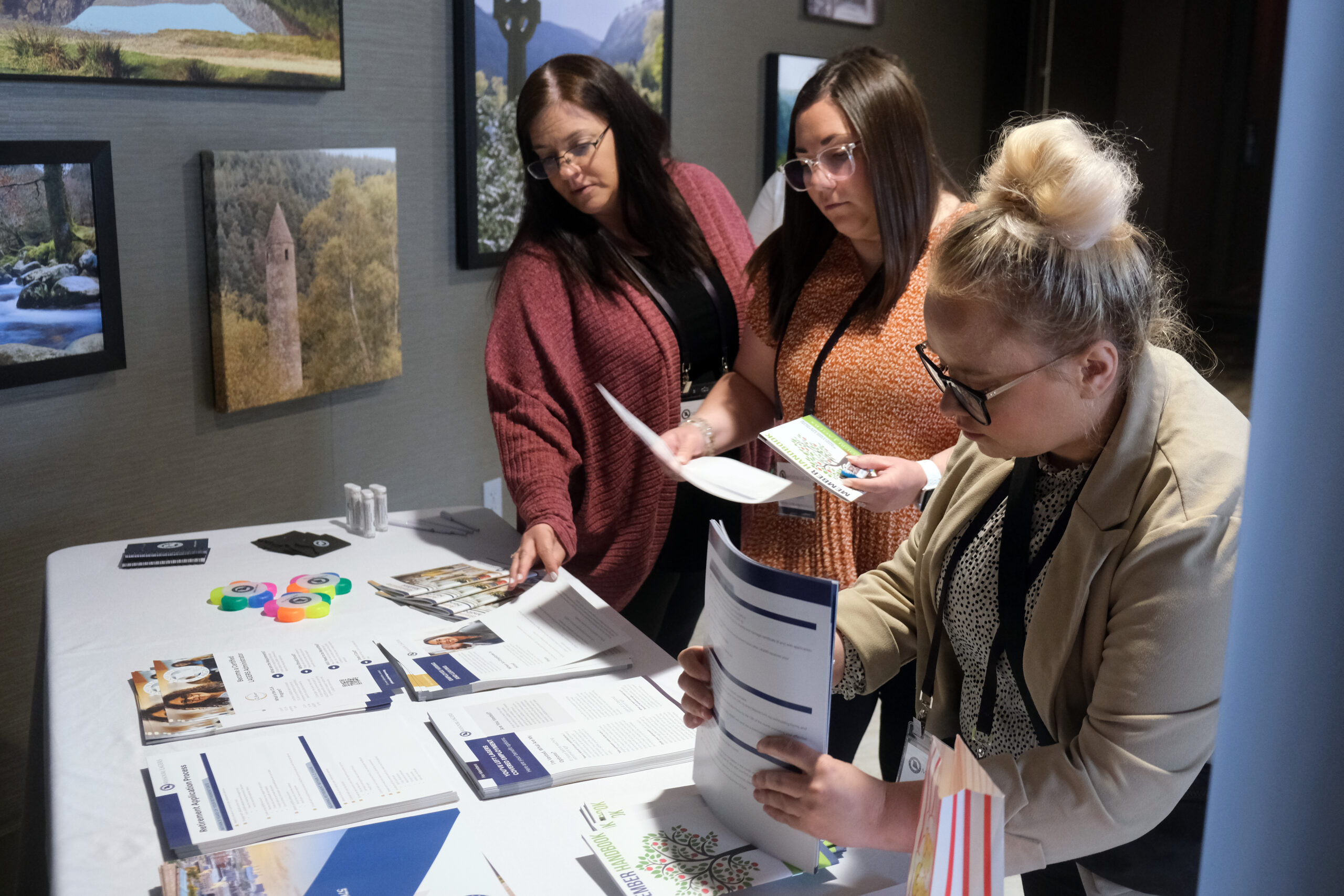 Attendees pick up presentation materials and LAGERS resources at the communications booth during the 2026 annual LEARN Conference held in Springfield, Mo. May 13-14. 2026.