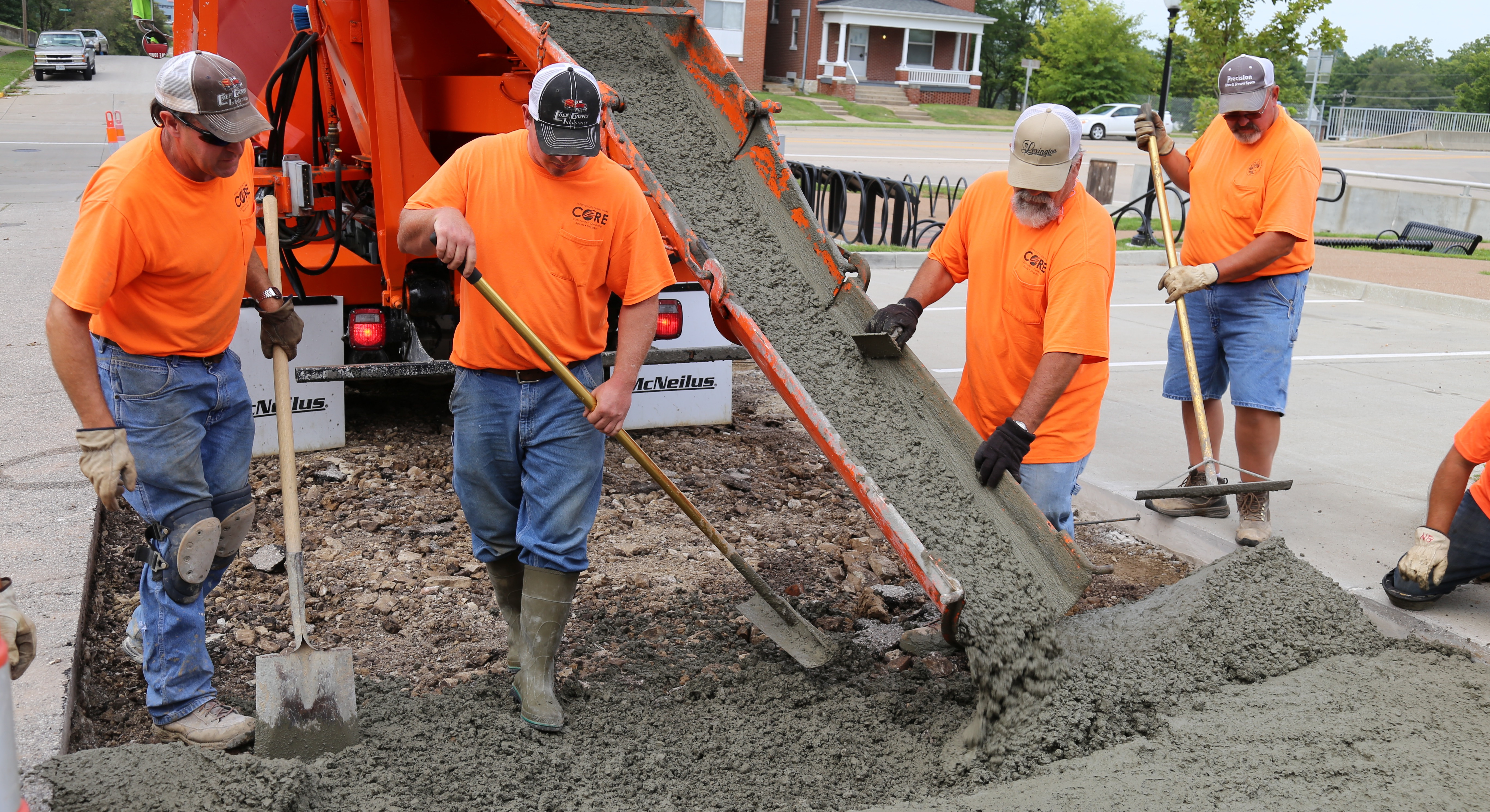Jefferson City road crew resurfacing a city street
