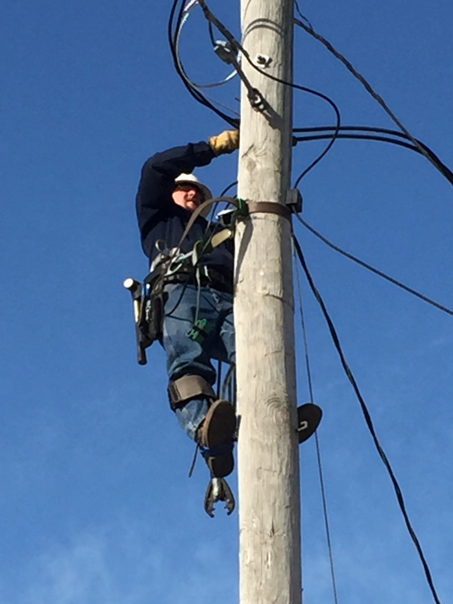 Noah Smith climbing electric pole