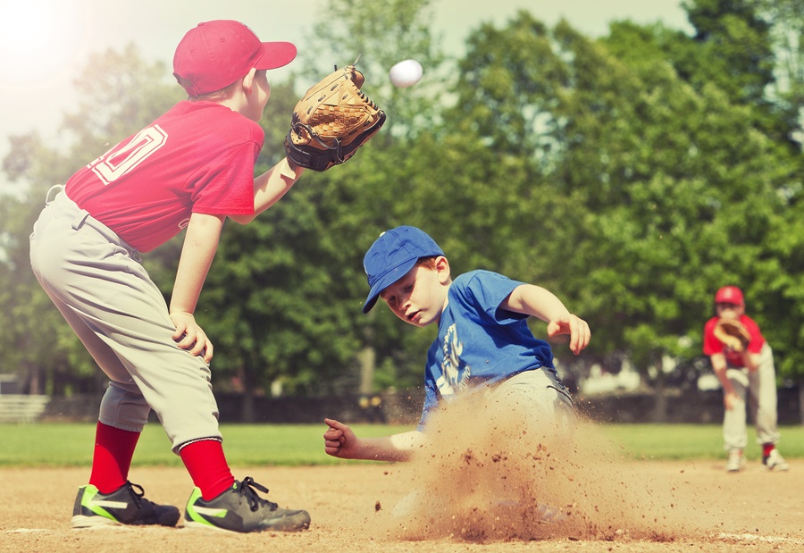 Boy sliding into base during a baseball game with Instagram styl