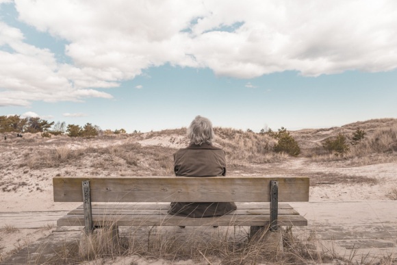 person on bench thinking